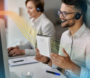 Customer support team using headsets and computers for professional support and communication.